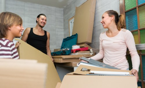 Person organizing belongings in a Grangepark storage space