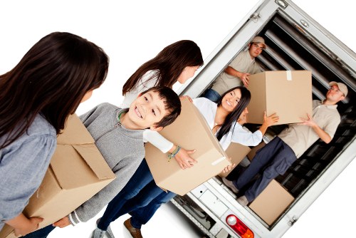 Professional local removals team handling boxes in Grangepark